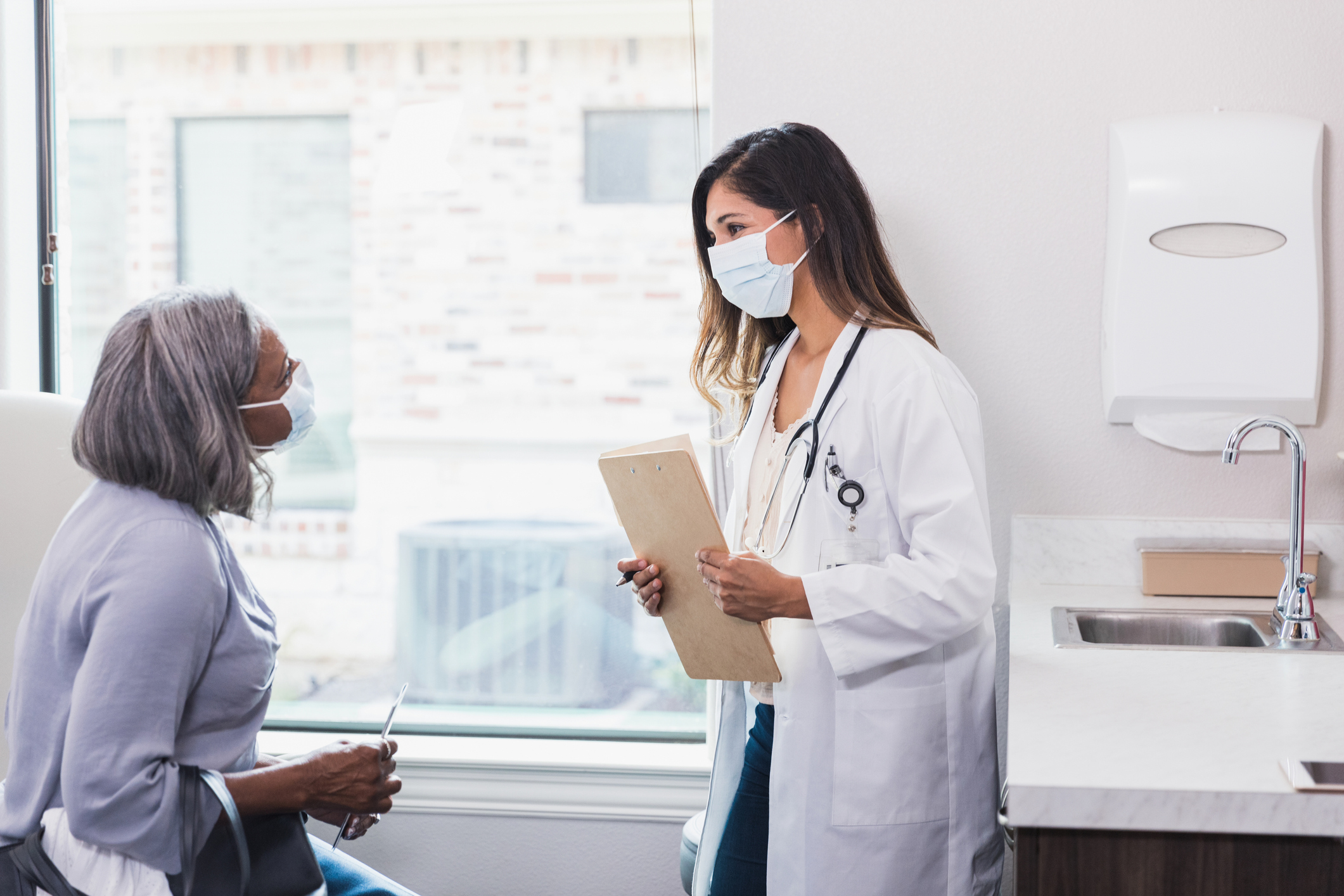 A patient talks to her doctor.