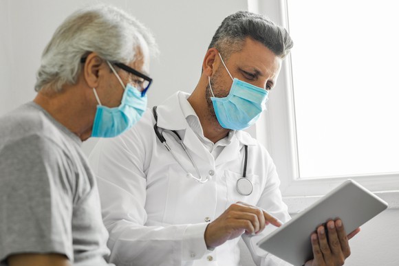 A doctor and a patient meet for an appointment.