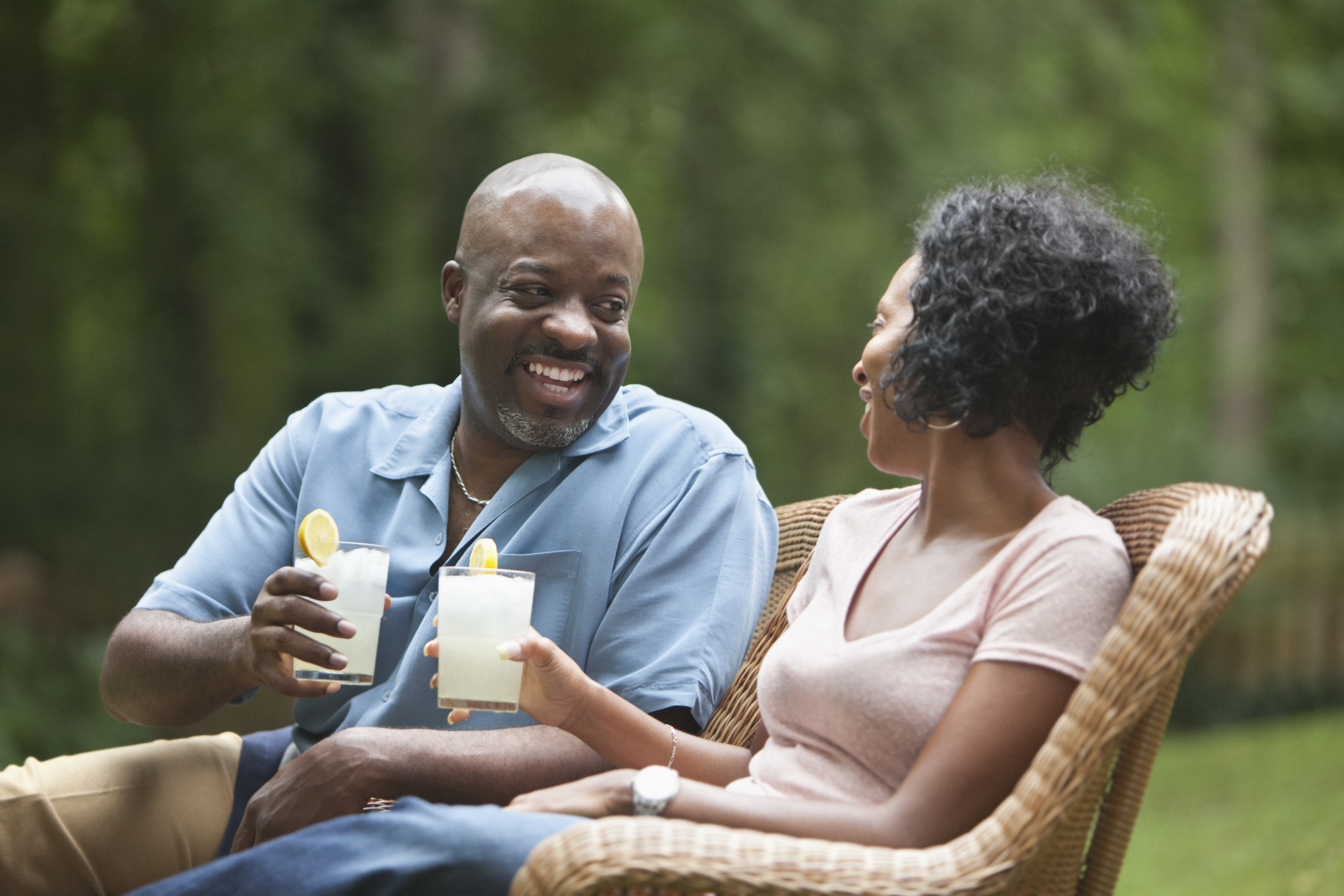 Couple relaxing with a glass of lemonade.