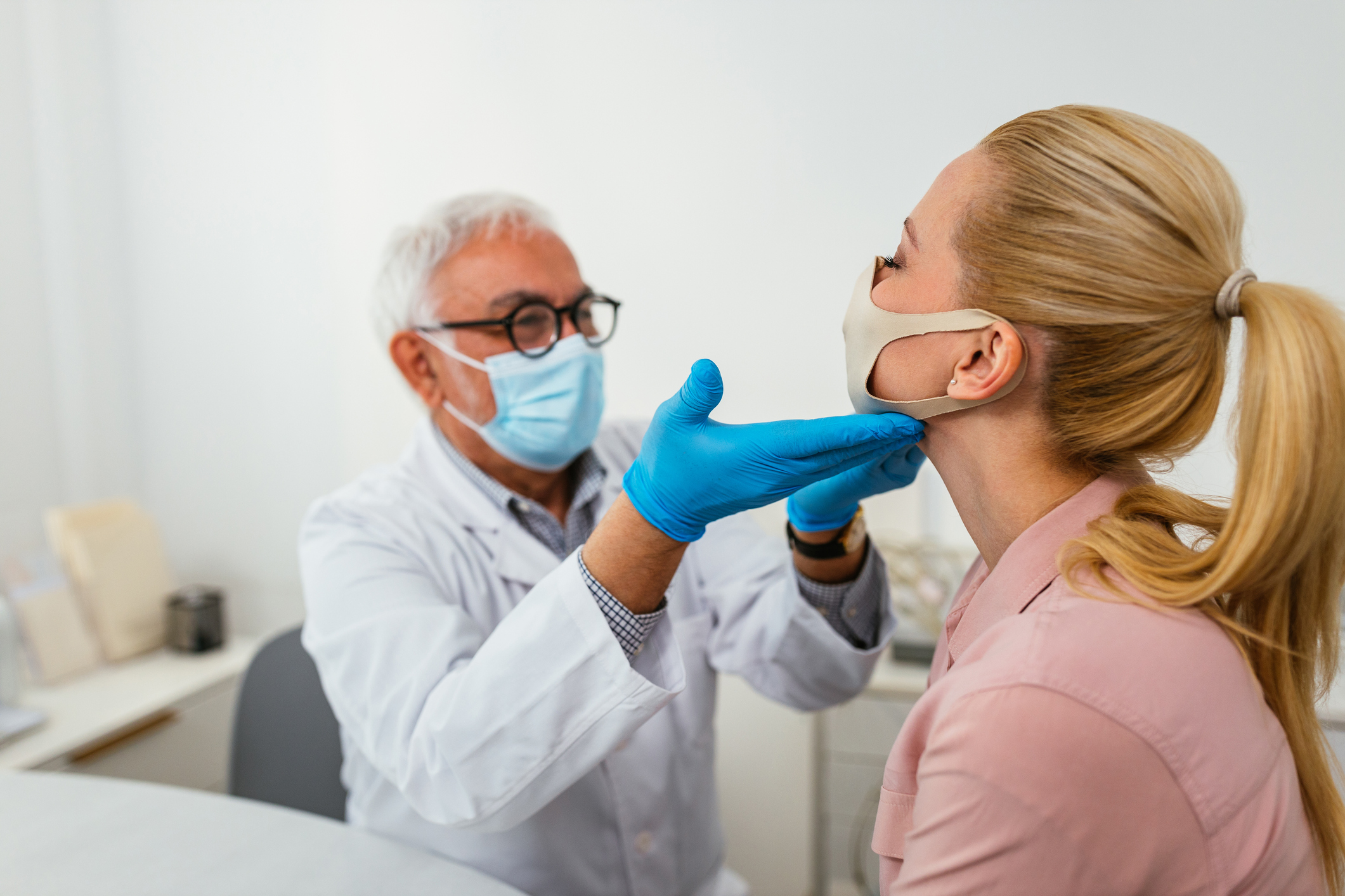 A doctor performs an exam on a patient.