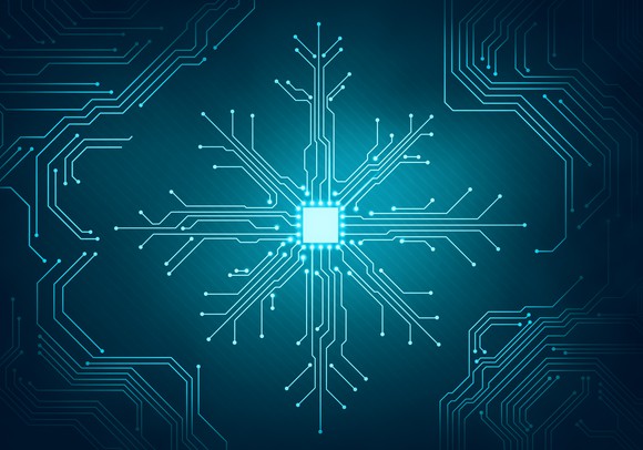 A computer motherboard with wires in the shape of a snowflake.