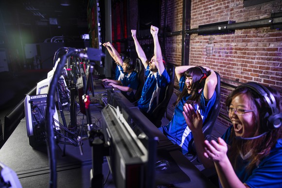 Video game players cheering. 
