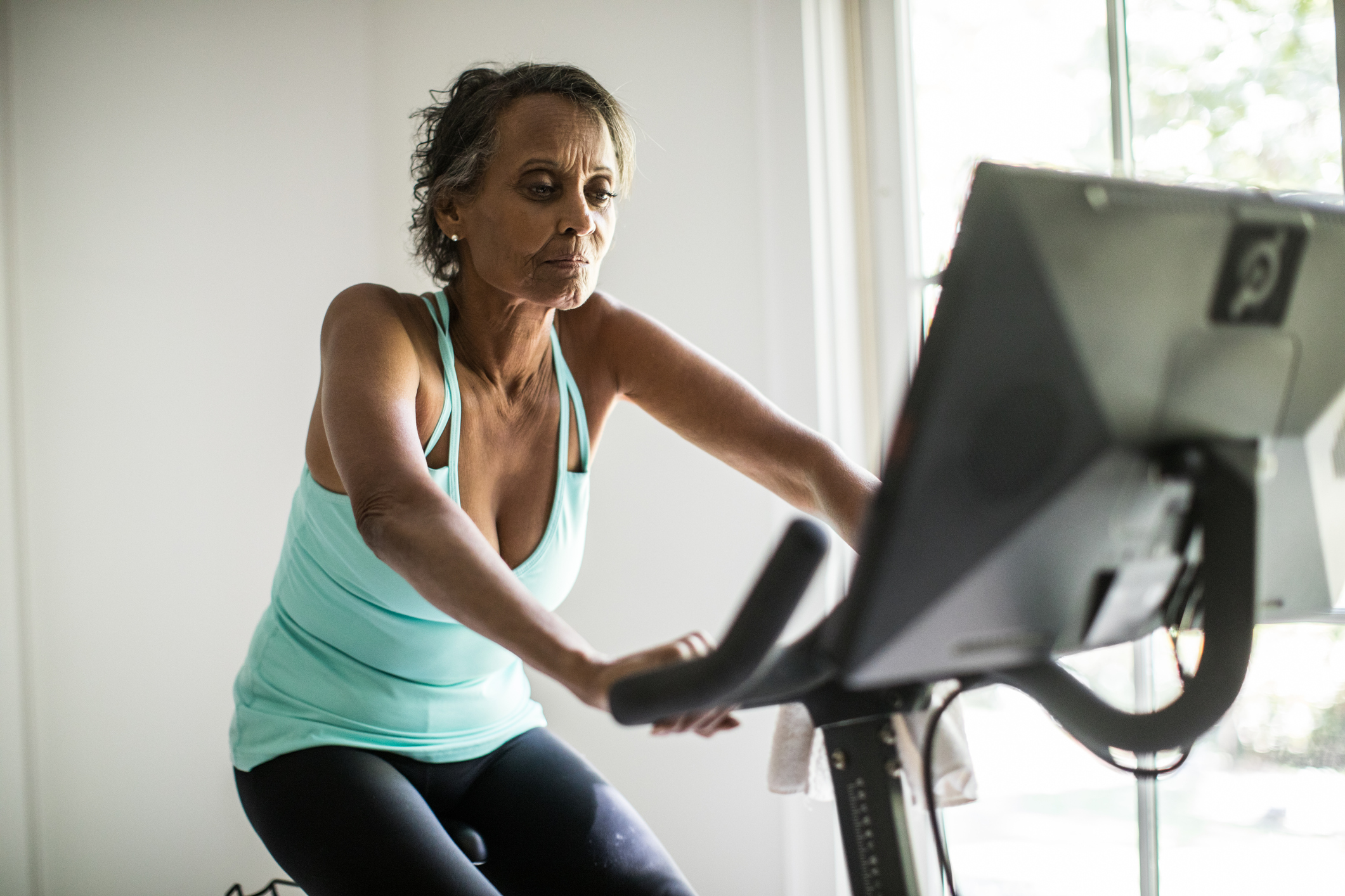 A person on an exercise bike.