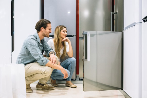 A couple shopping for new home appliances.