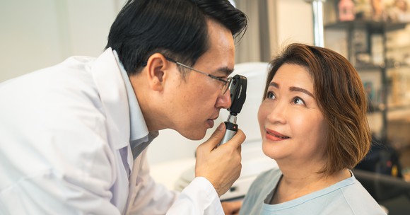 Eye doctor examining a patient.