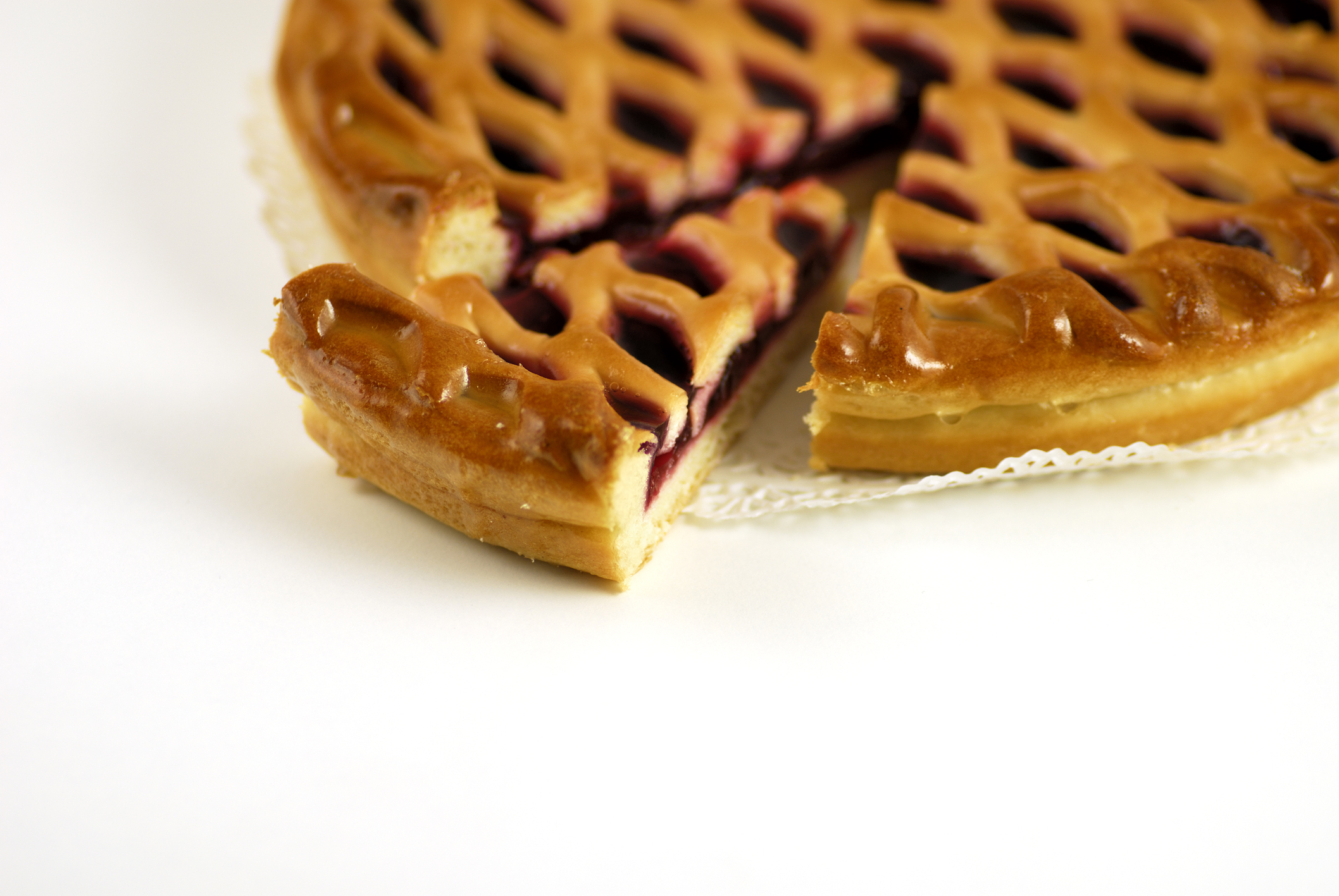 A small slice of a large cherry pie.