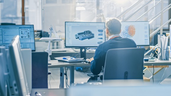 A man working at a computer.