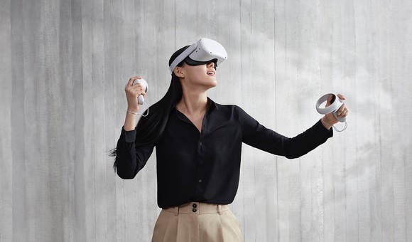 A person uses an Oculus Quest 2 headset.