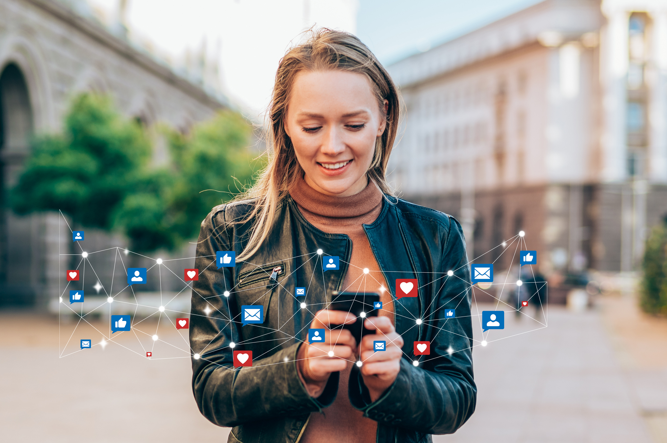A person uses smartphone apps outside.