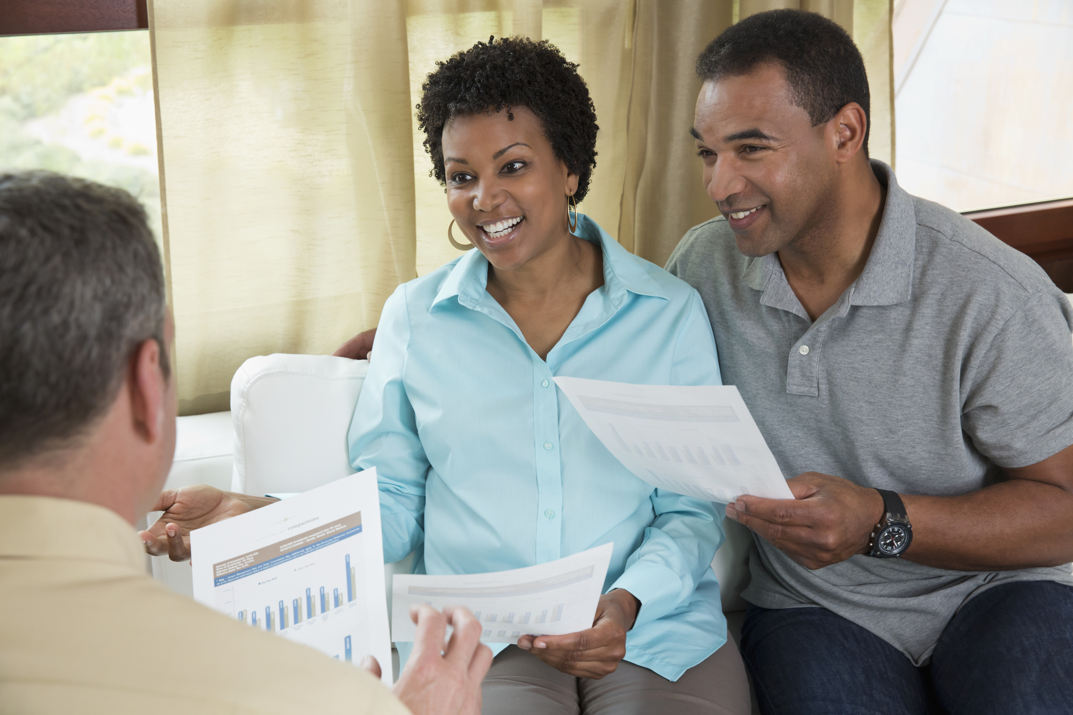 Financial advisor talking with clients.