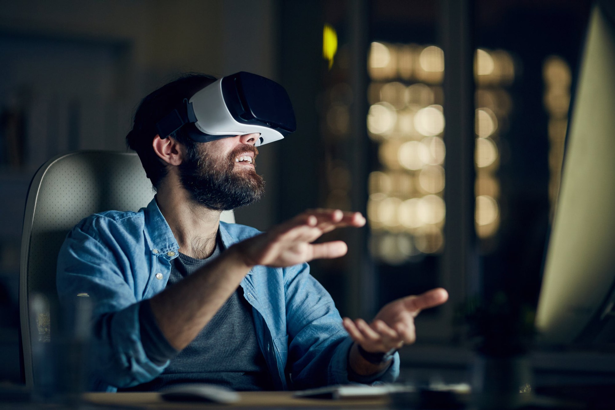 A person wearing a virtual reality headset and interacting with the virtual world.