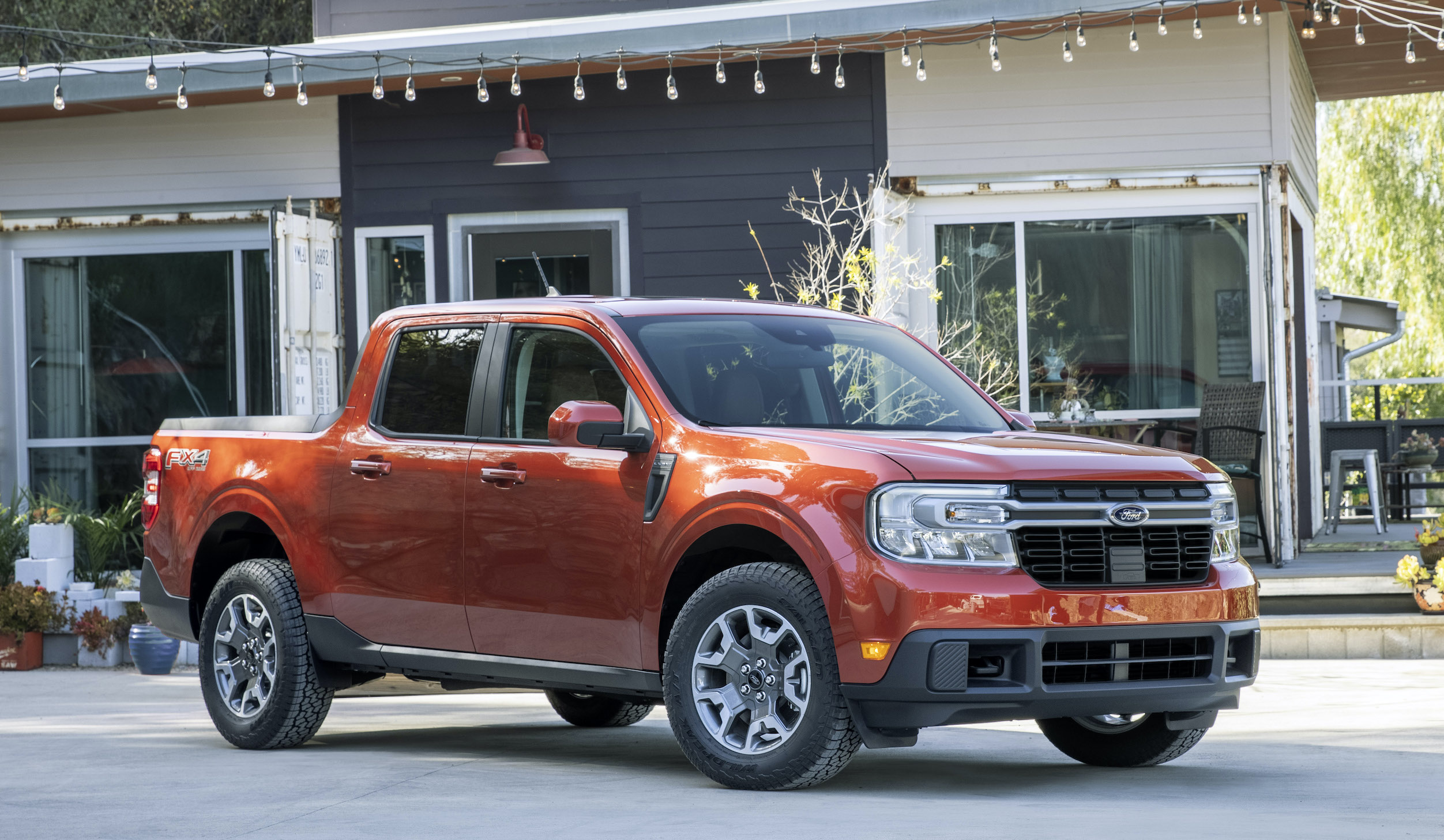 An orange 2022 Ford Maverick, a compact pickup truck.