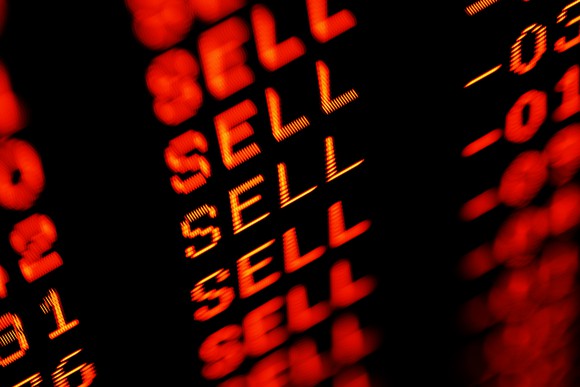A stock screen with the word Sell in red several times.