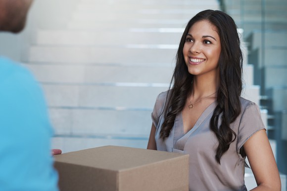 Person receiving e-commerce package.  