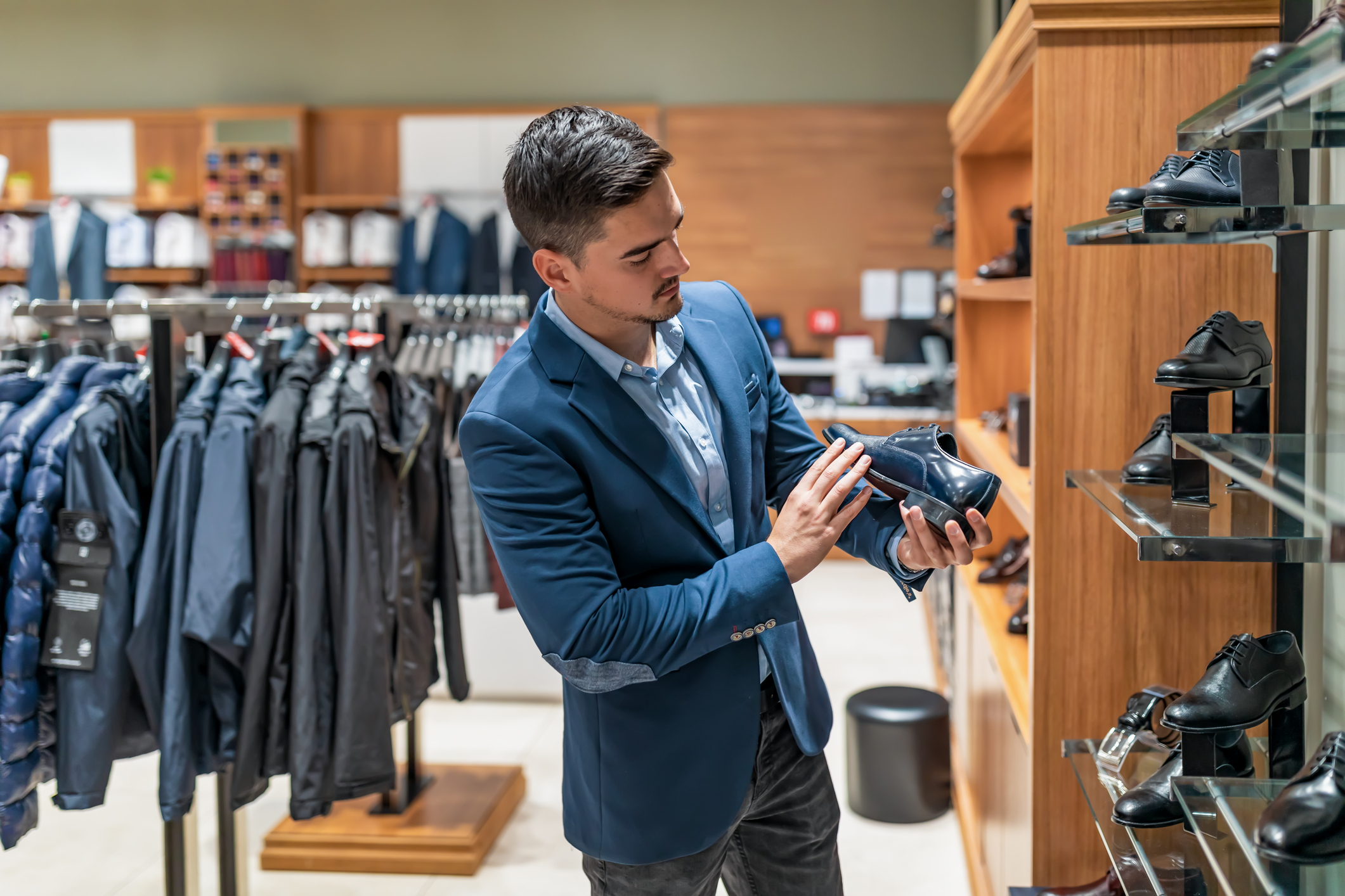 A person shopping in a clothes store.