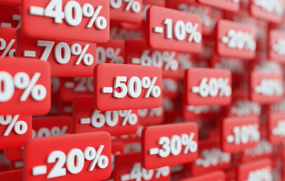 Small, rectangular red tags showing different negative percentages. 