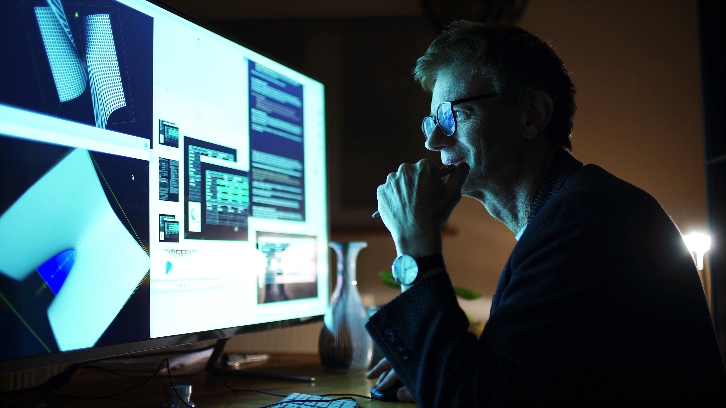 Person creating 3D designs on computer.