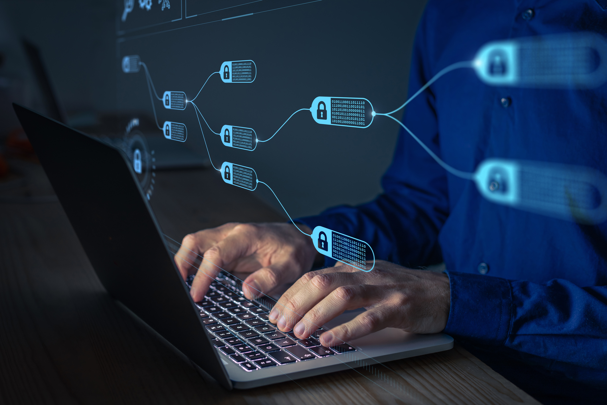 Person using a laptop with a virtual flowchart of security locks and encrypted data.