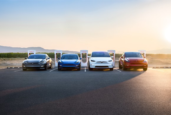 Tesla vehicles at a Supercharger station.