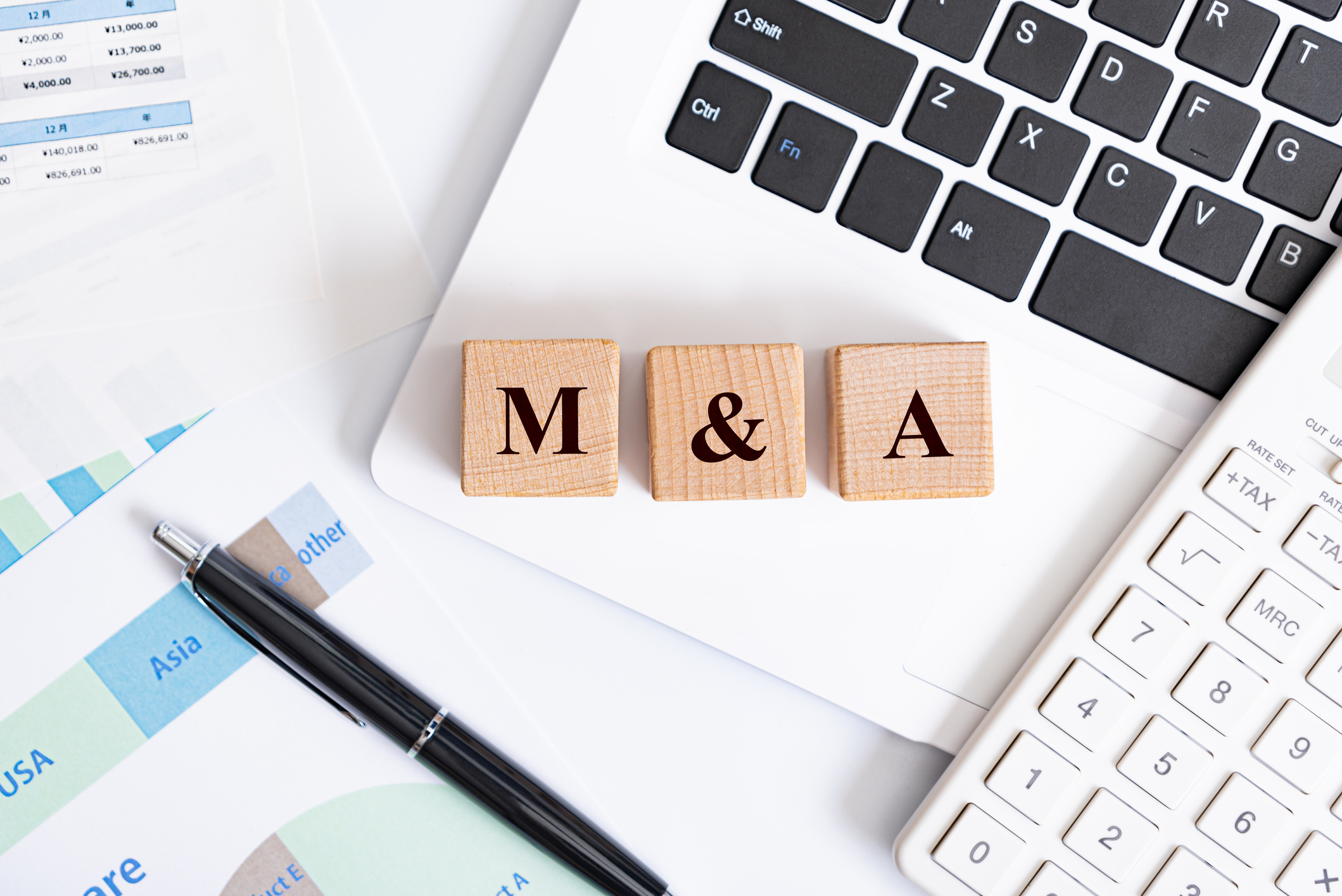 Wooden blocks spelling out M&A.