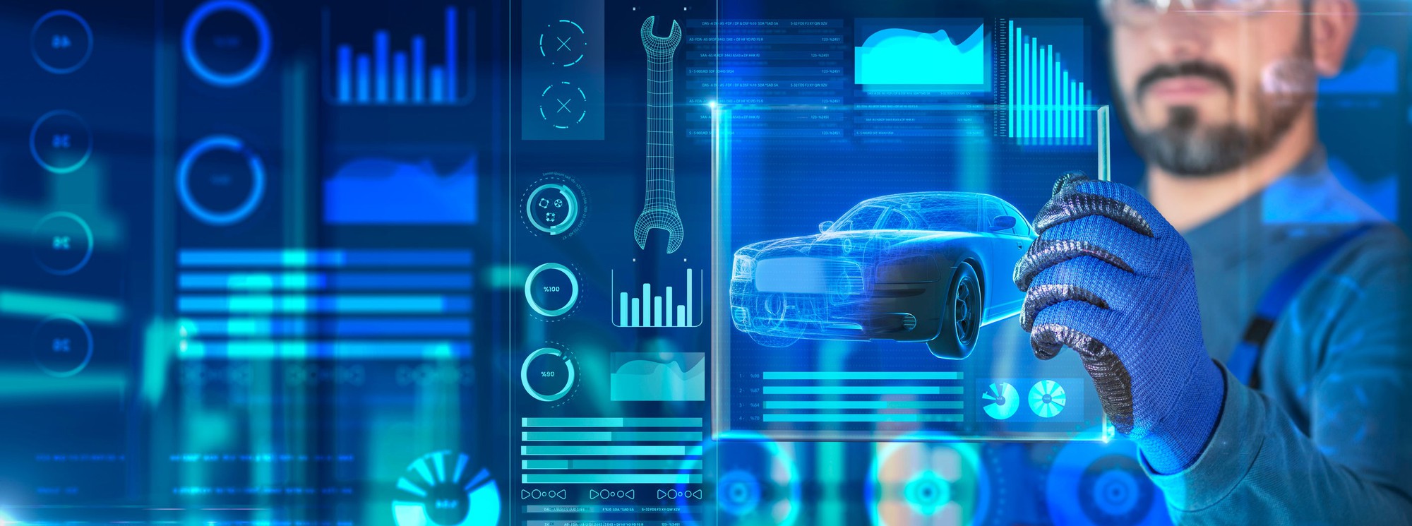 A worker designs EV concepts on a blue digital display.