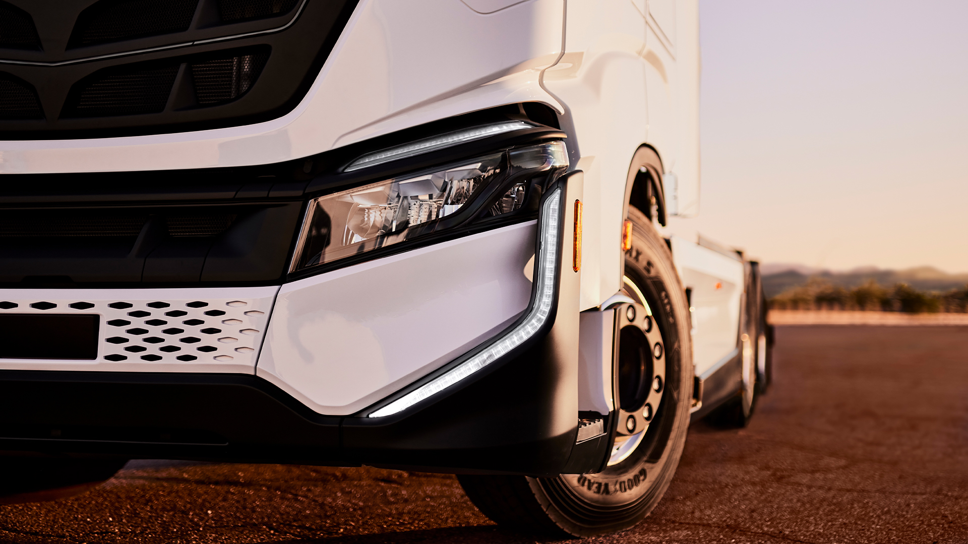 front of white Nikola Tre battery electric semi truck.