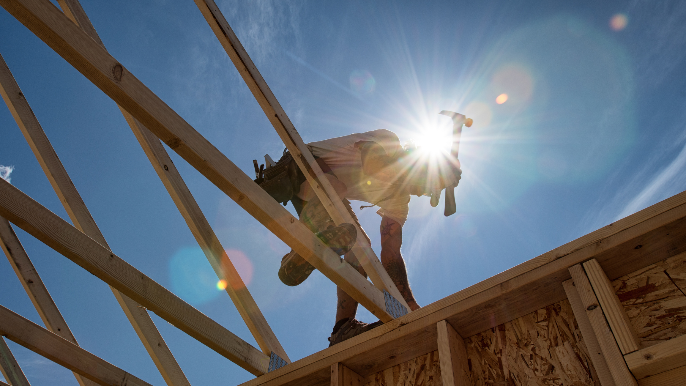 A person building a home.