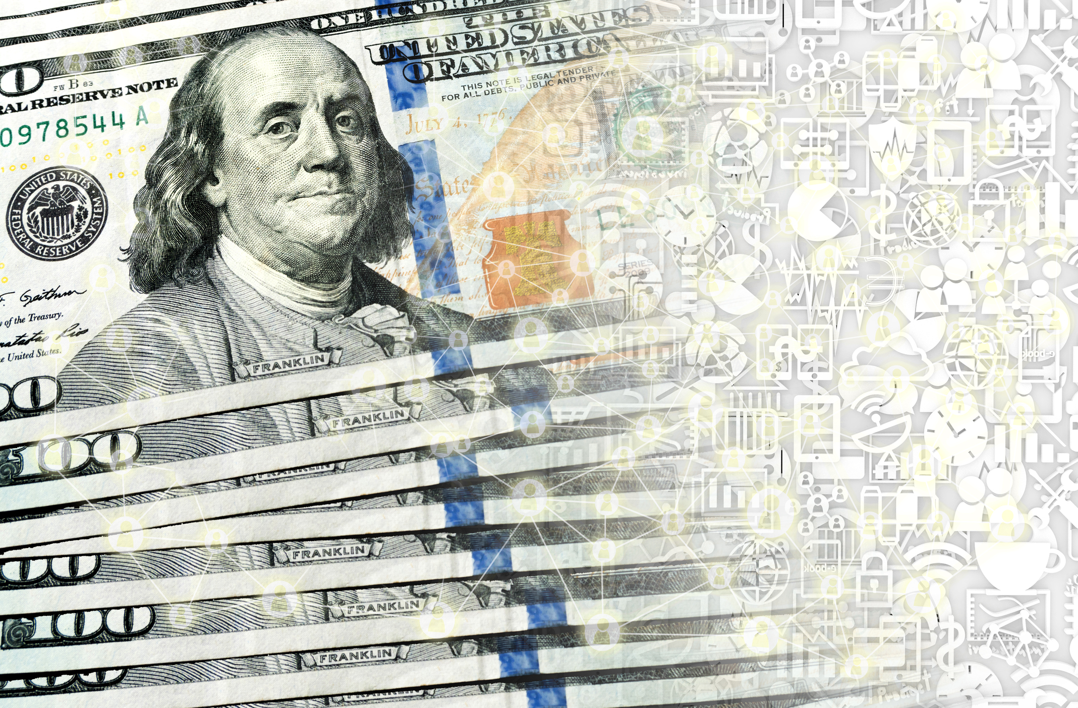 A neatly staggered stack of one hundred dollar bills transforming into digital currency on blockchain.