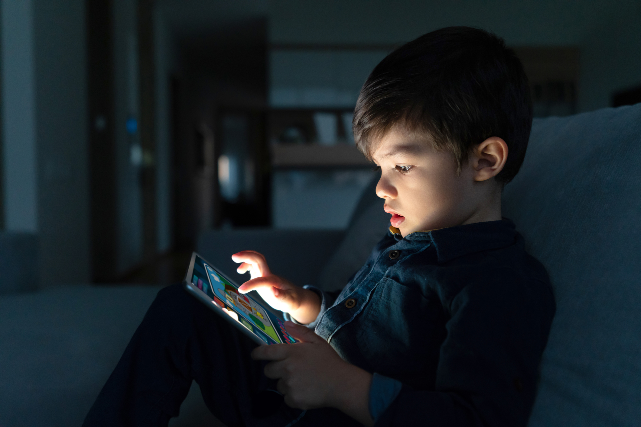 Child playing game on tablet computer