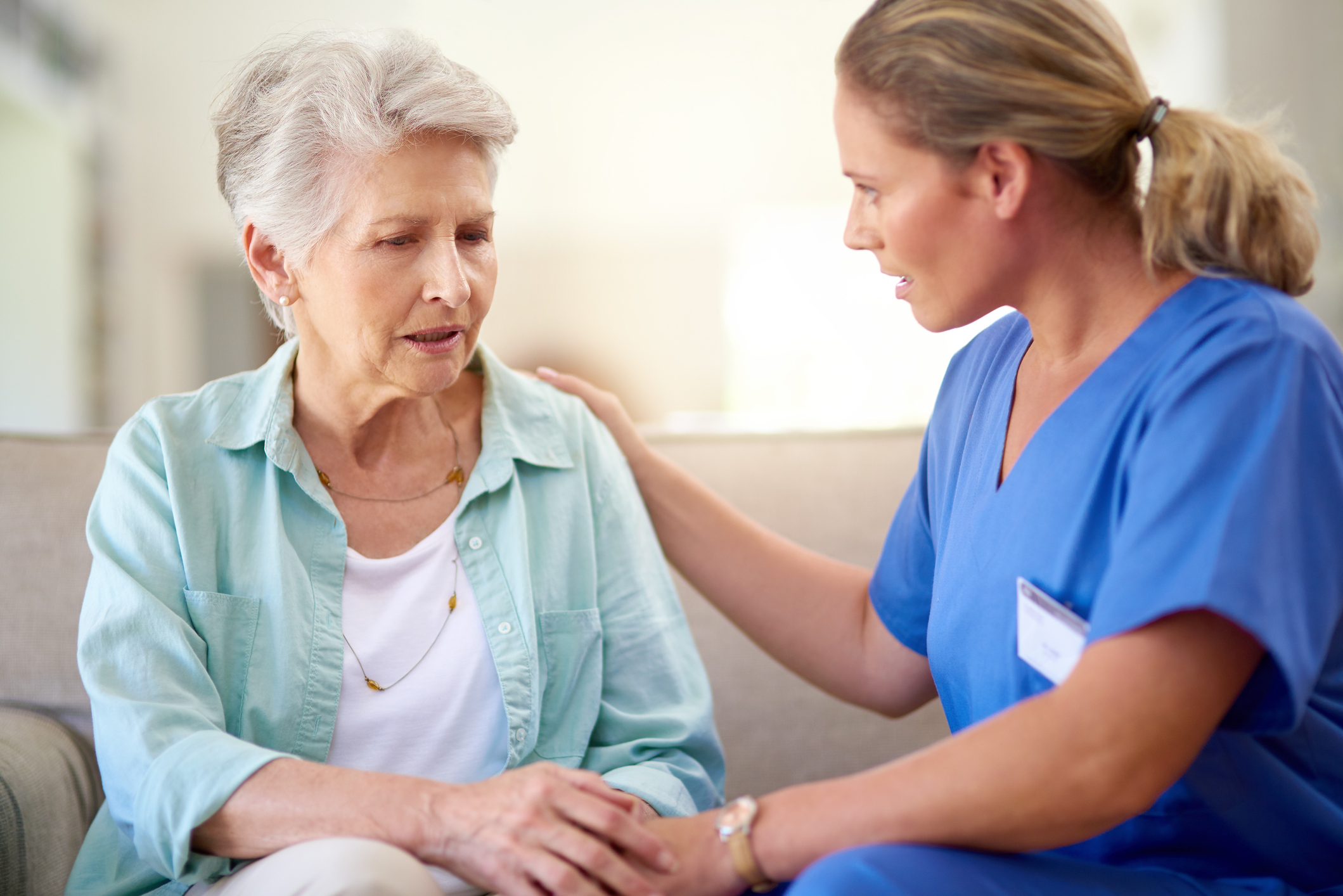 Physician sitting with patient.