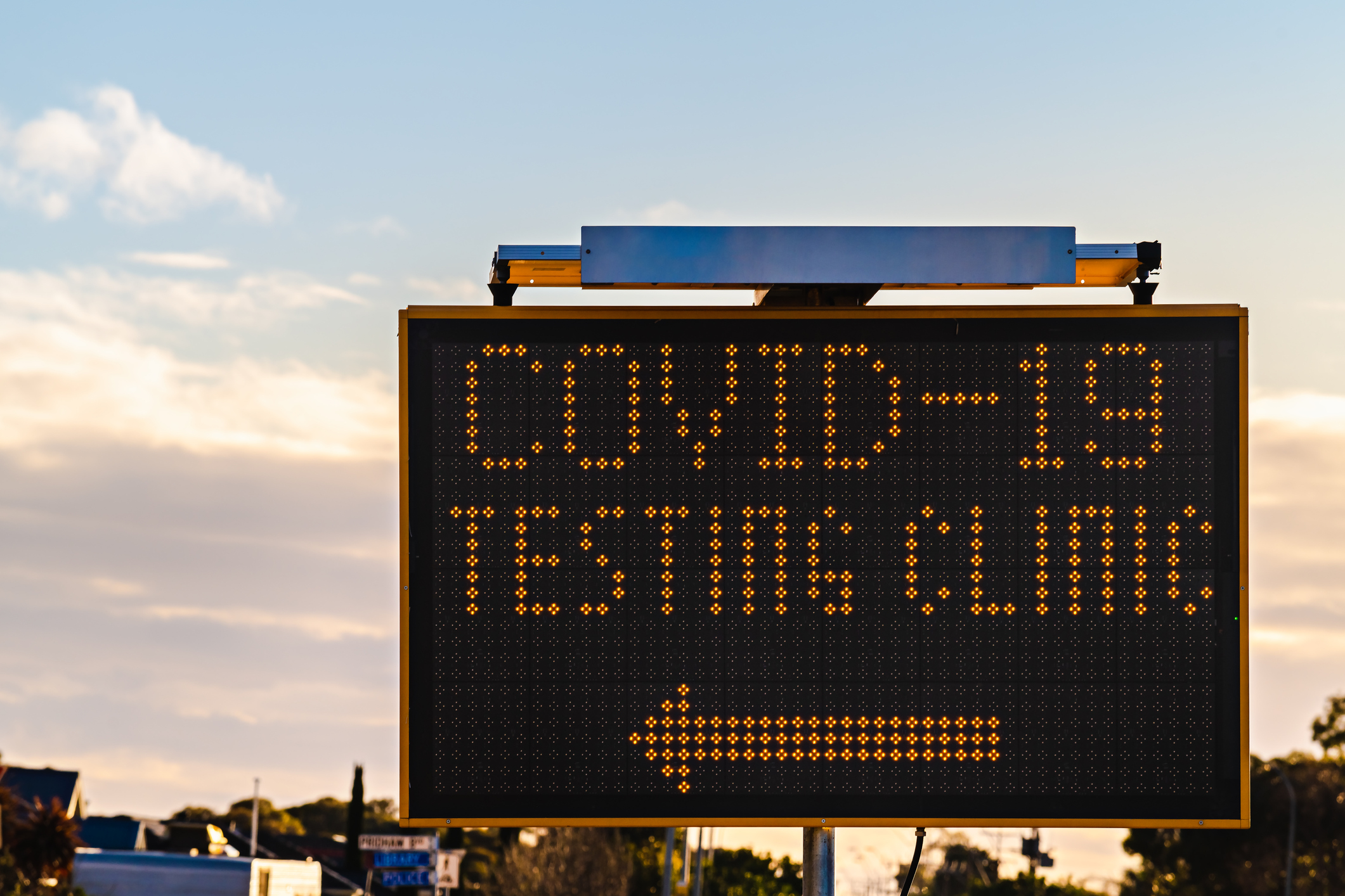 A sign gives directions to the nearest COVID-19 testing clinic.