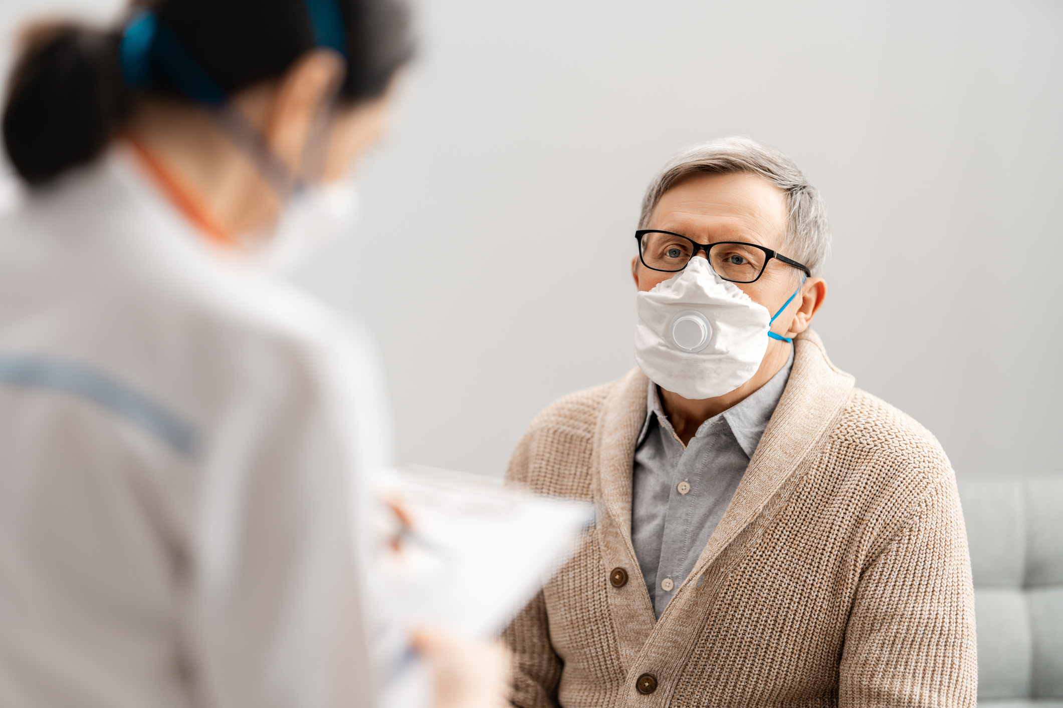 A doctor speaking with a patient.