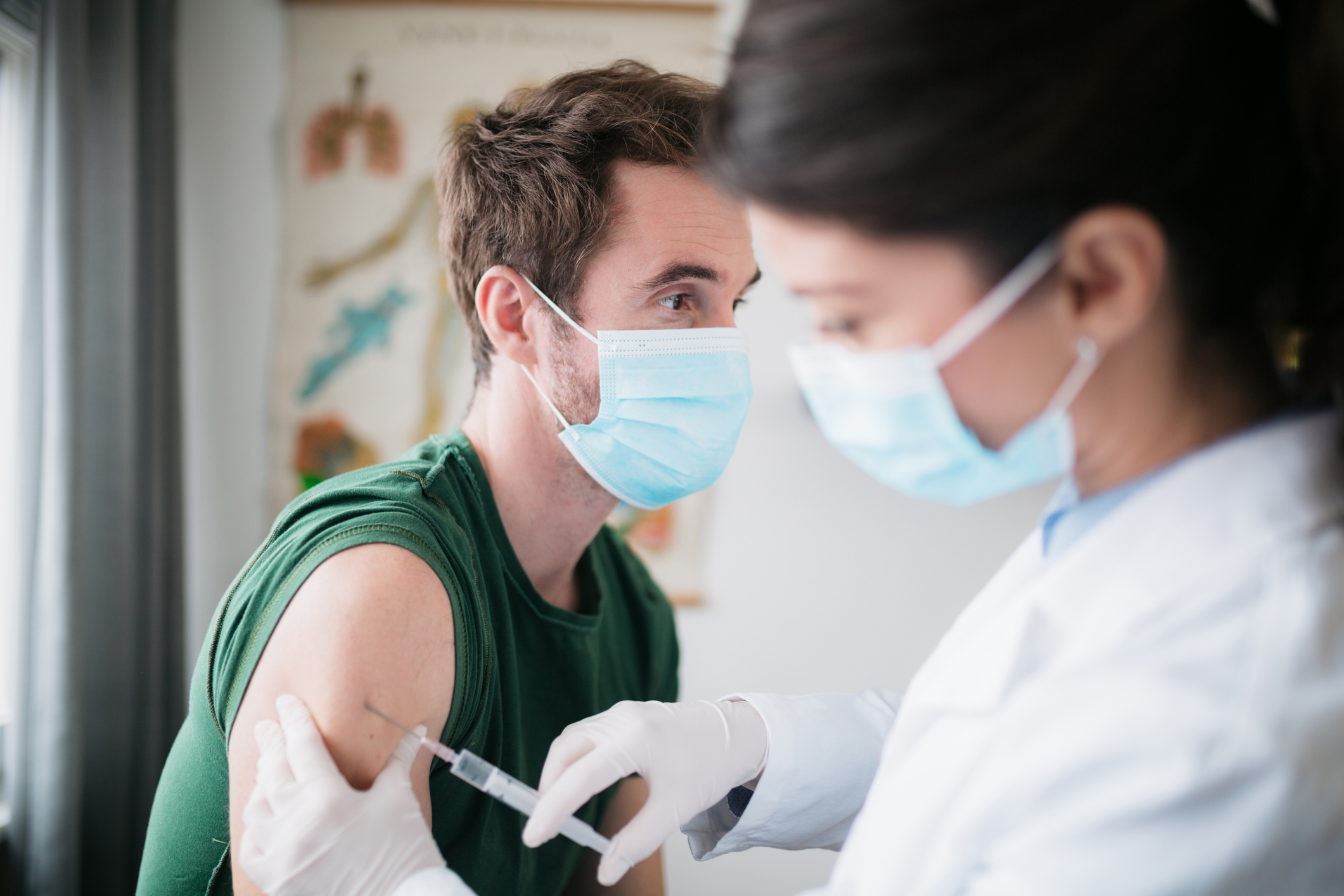 Vaccine being given to young man
