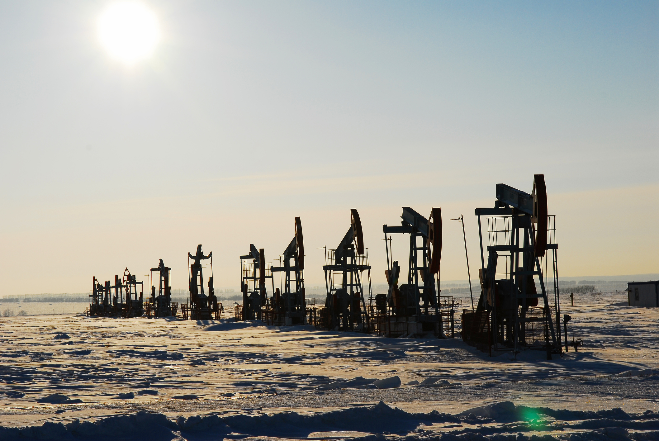 Oil derricks in a field.