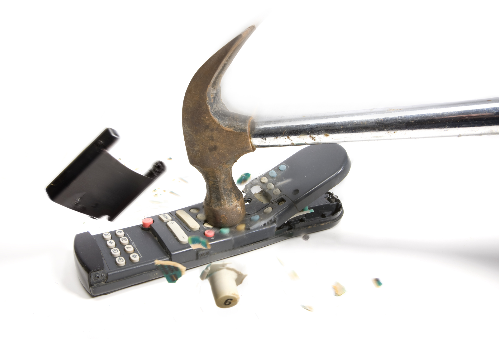 Hammer breaking a TV remote control.