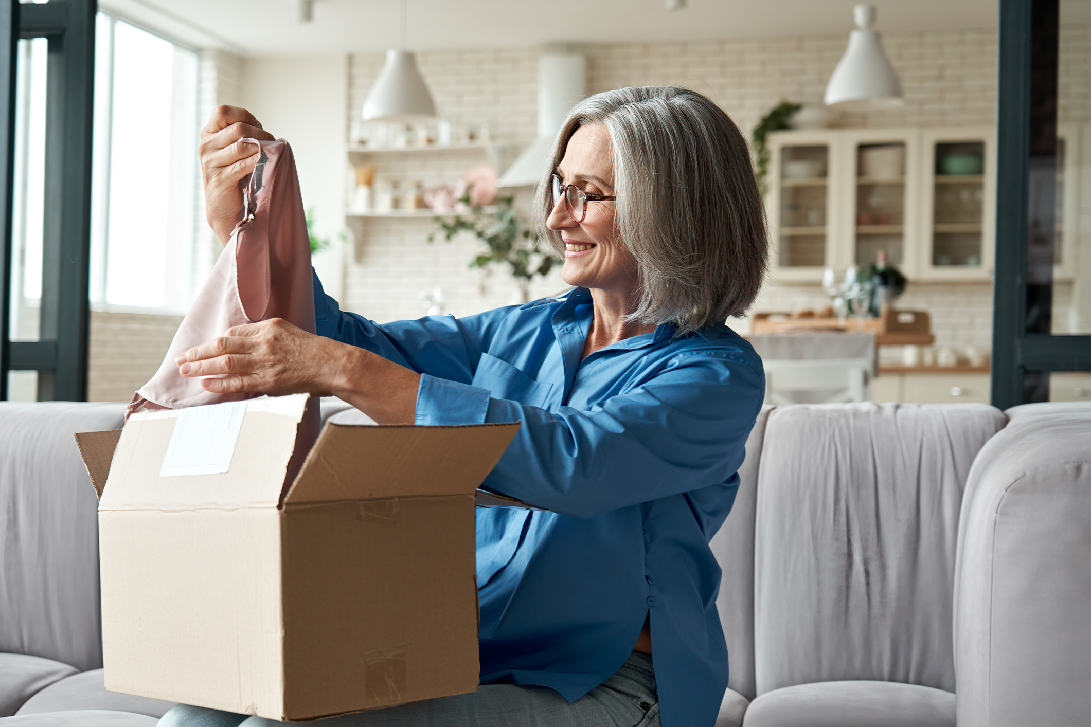 A person opening a package.