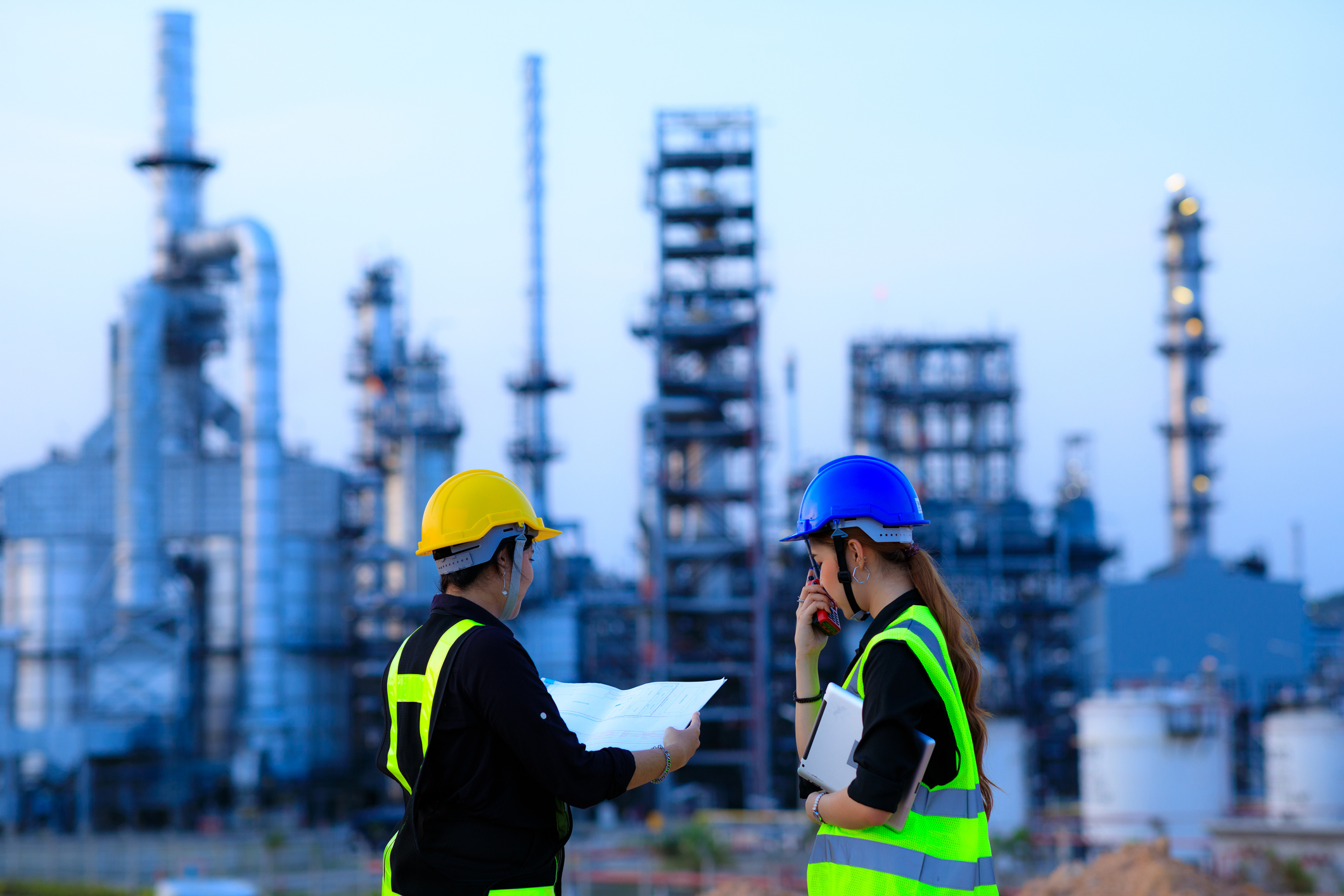 People working at a refinery.