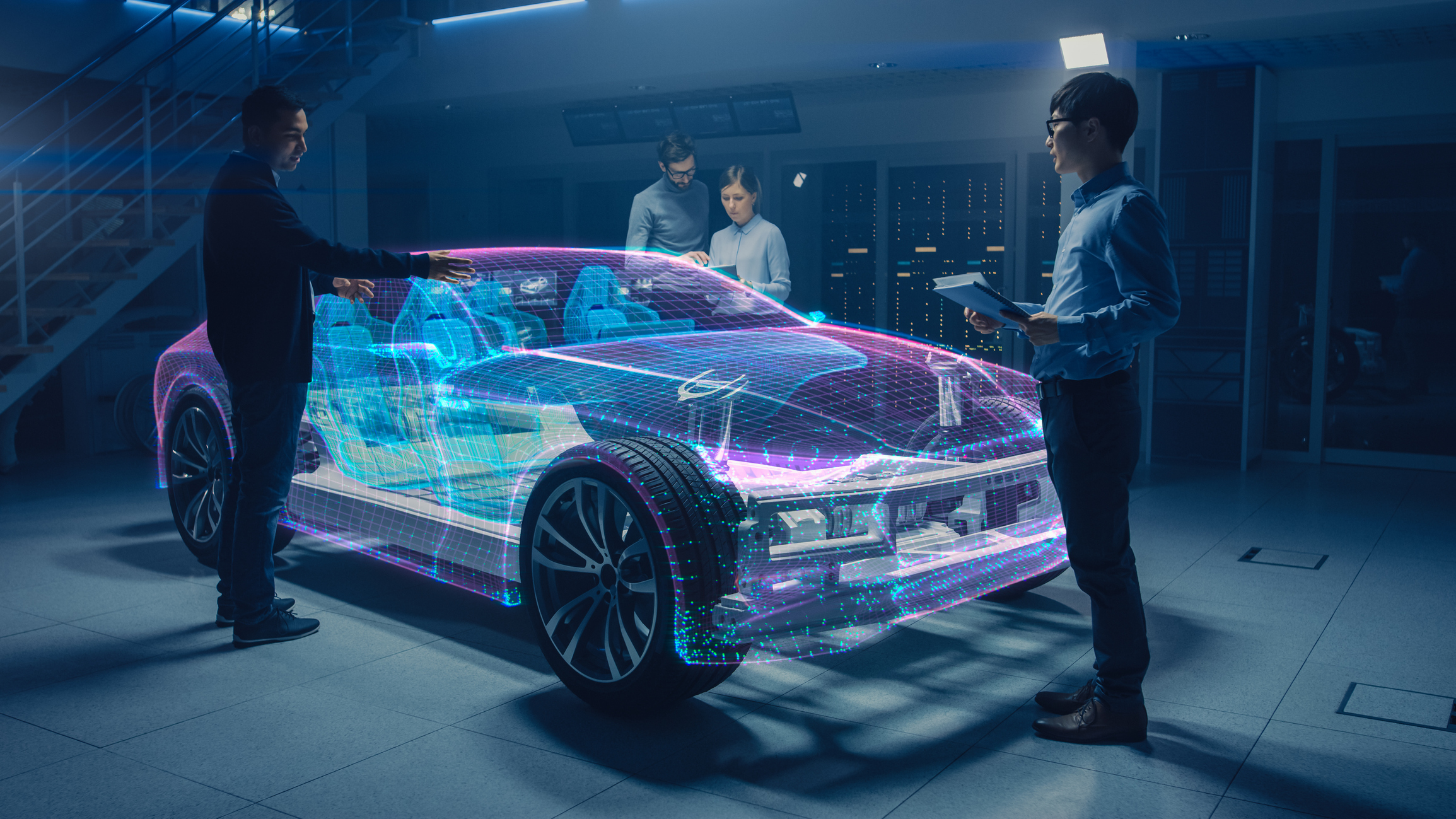 A group of engineers examine an AR projection of a vehicle.