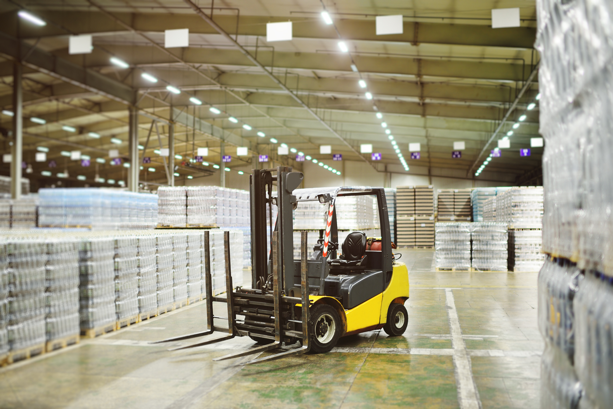 Forklift in middle of warehouse getty images
