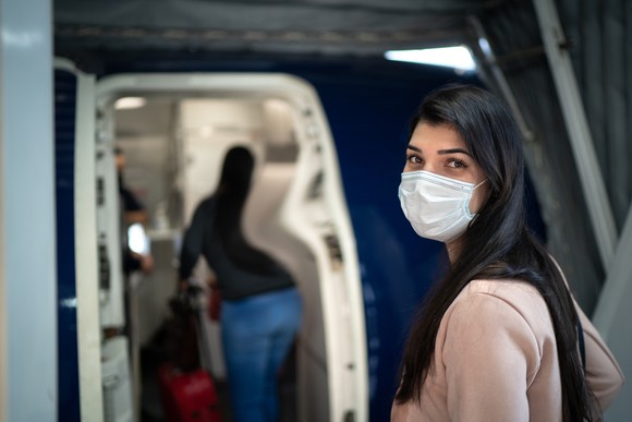 A passenger entering a plane. 
