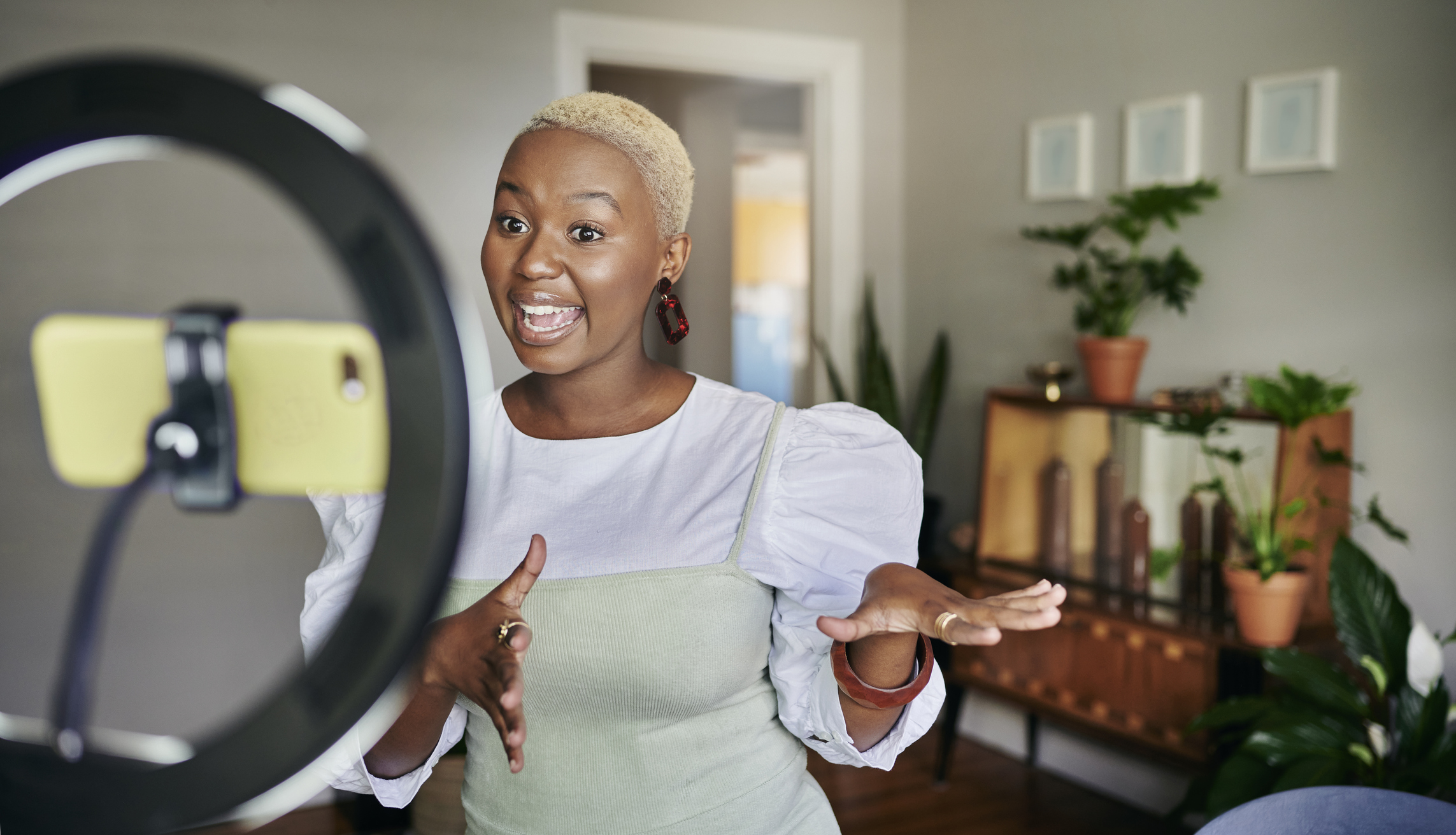 Person recording a video for social media.