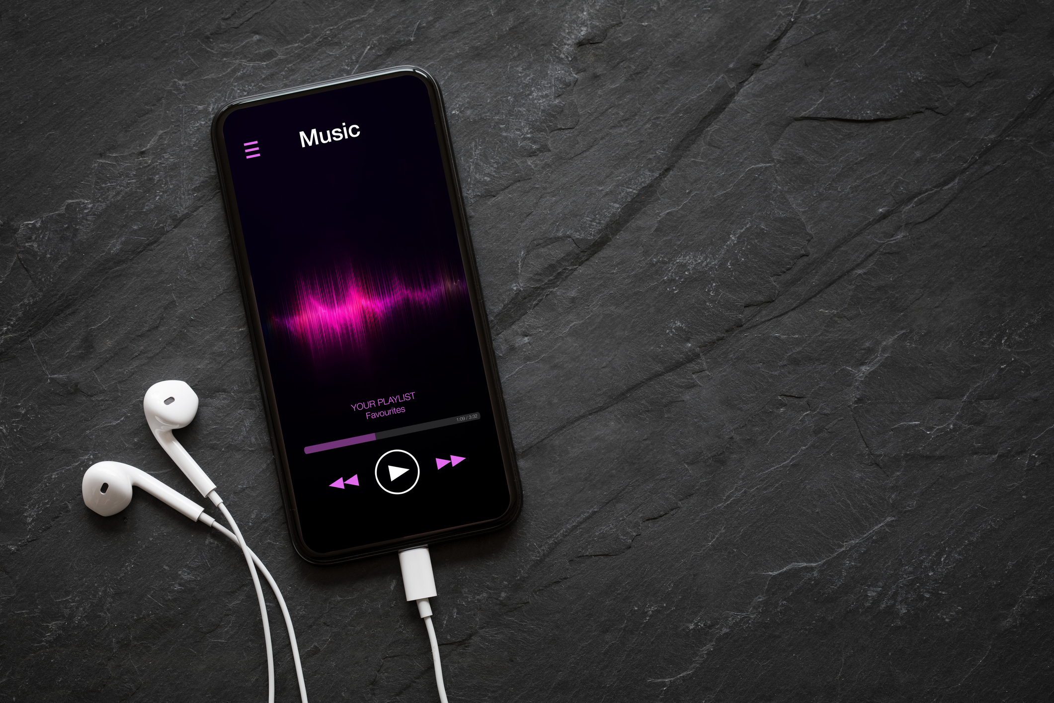 Smartphone playing music on a table.