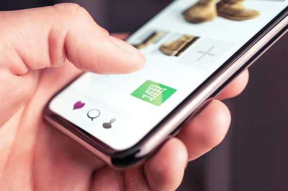 Person shopping on mobile phone.