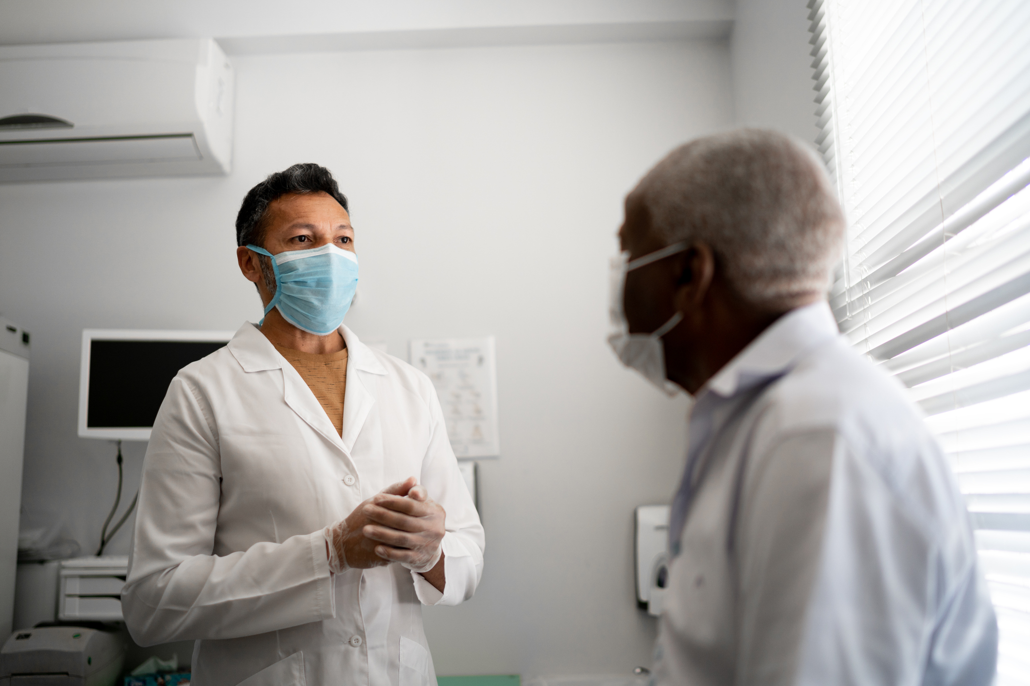 A patient and doctor meet for an appointment.
