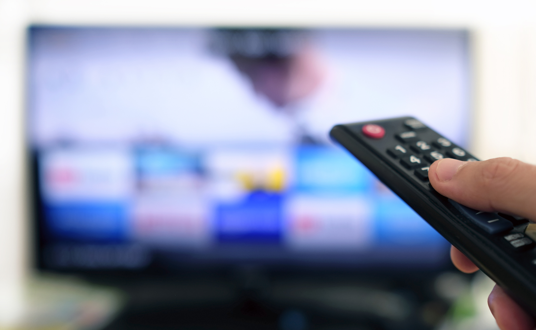 Remote control pointed at TV.
