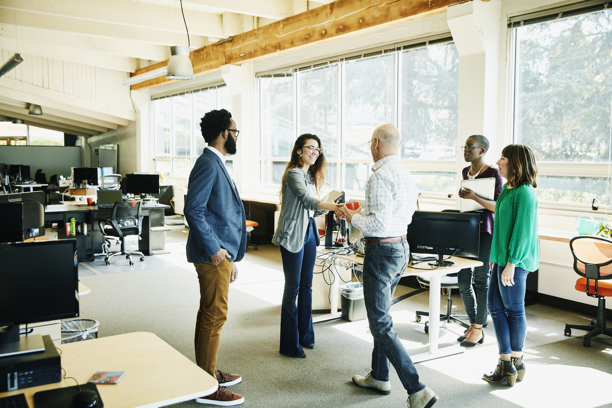 Two business teams meeting in an office.