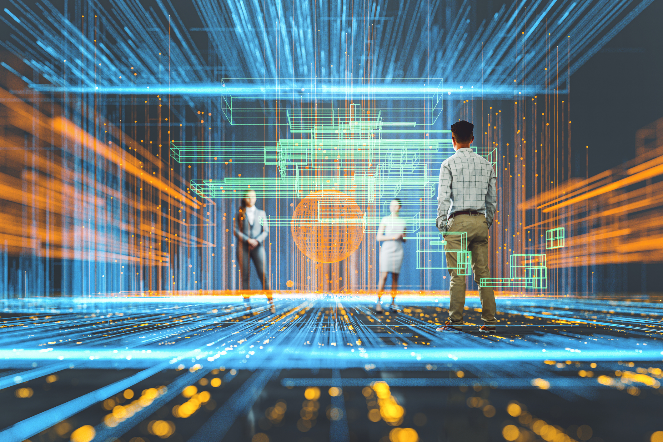 Three people standing in a high-tech space.