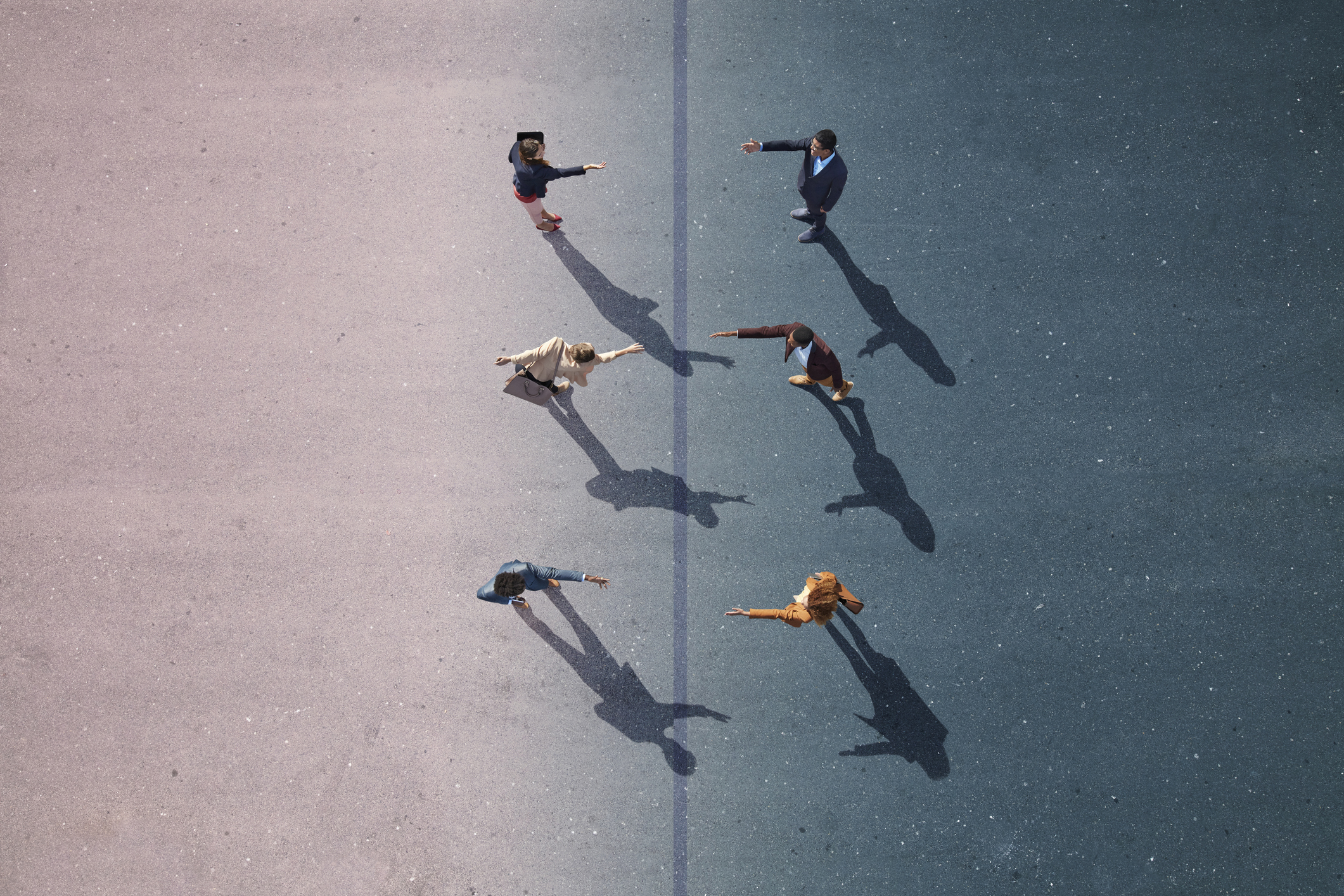 Three people holding out their hands to three people facing them.