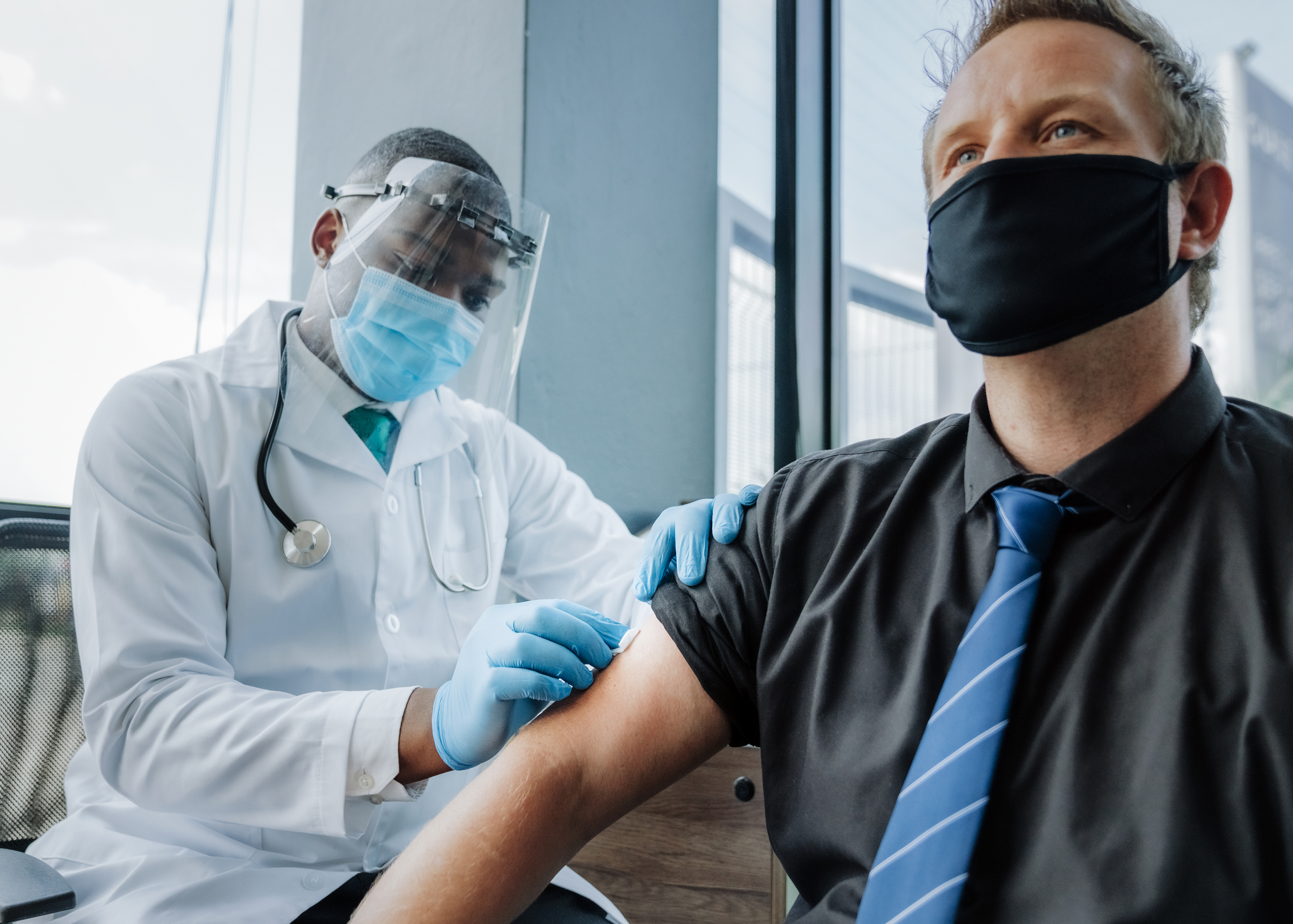 Person receiving a vaccine shot.