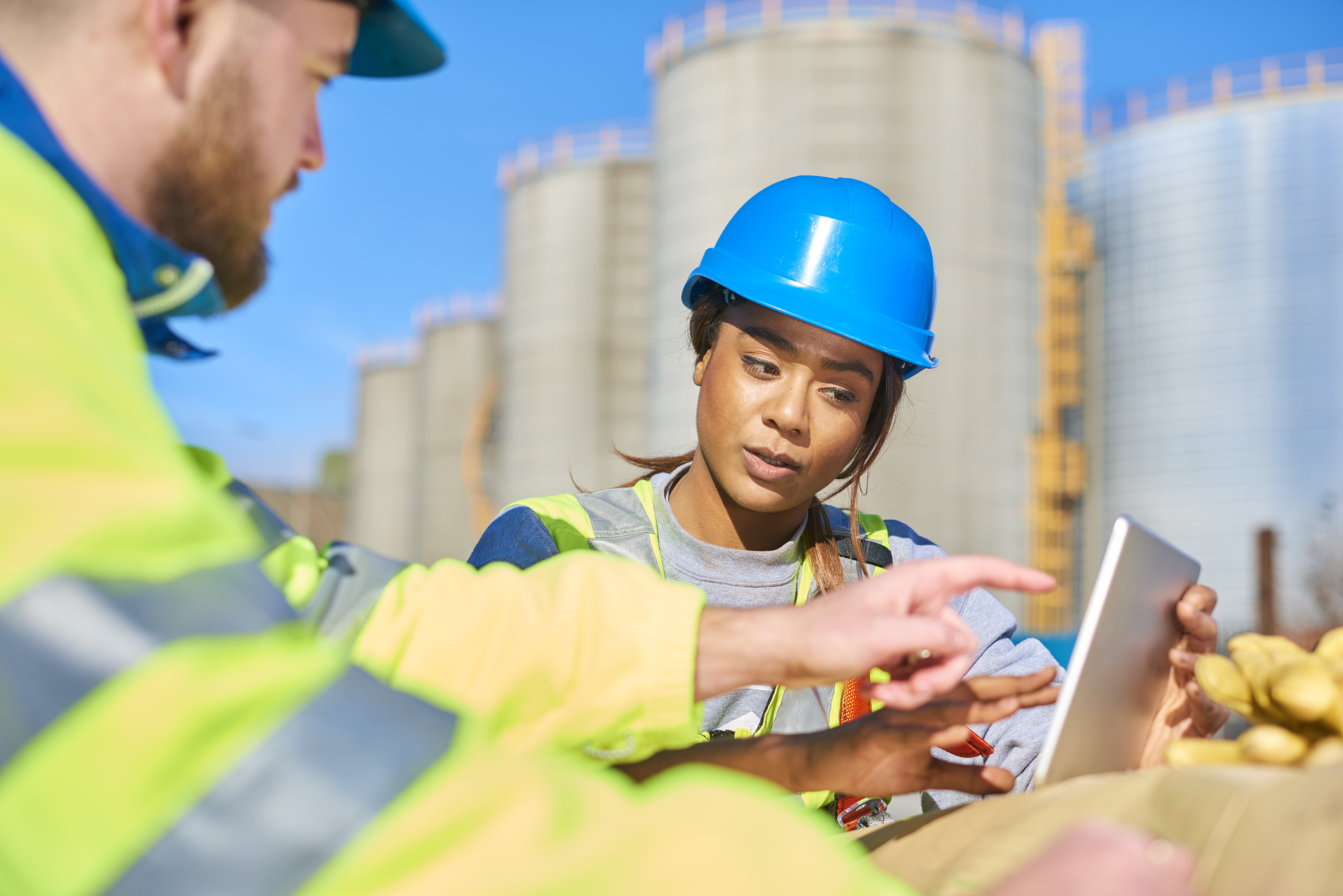 Two workers in an oil company